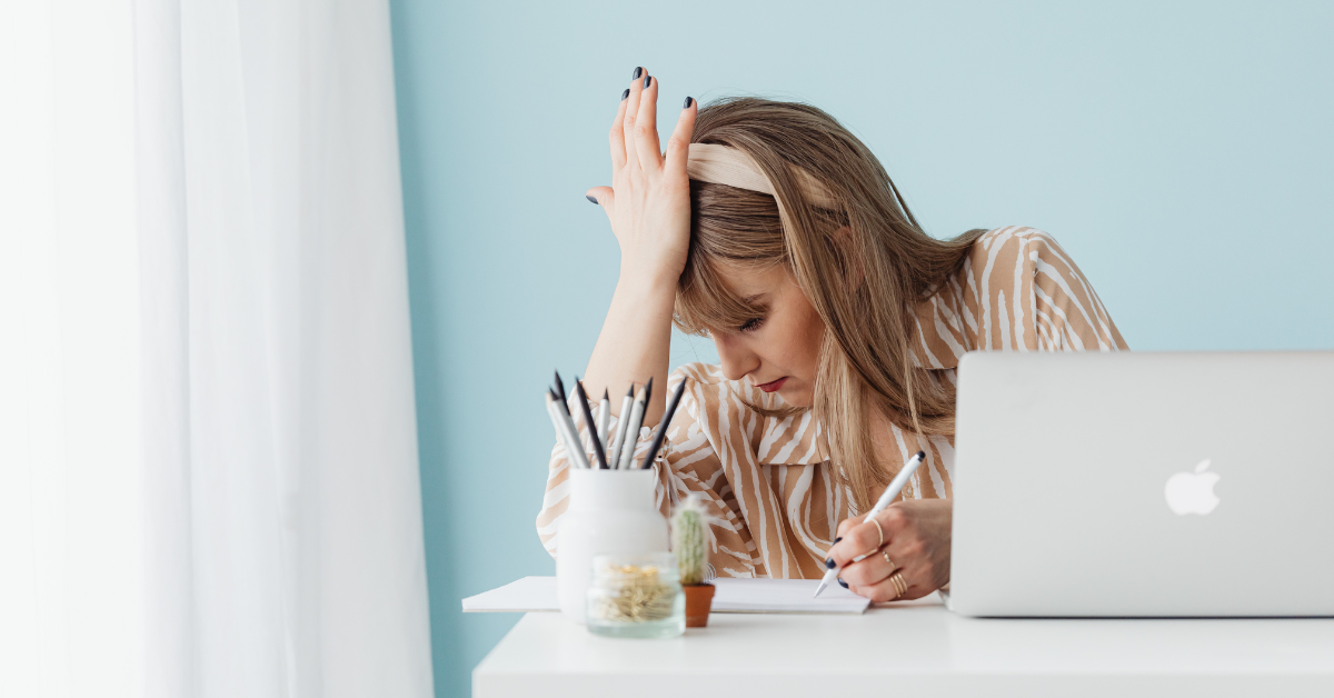 stressed woman at desk